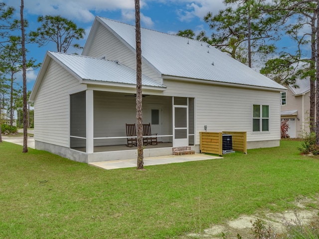 back of house with a yard