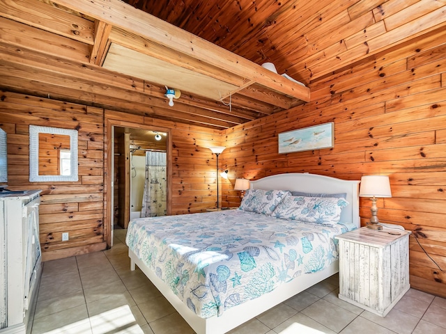 tiled bedroom with wood ceiling, wooden walls, and beam ceiling