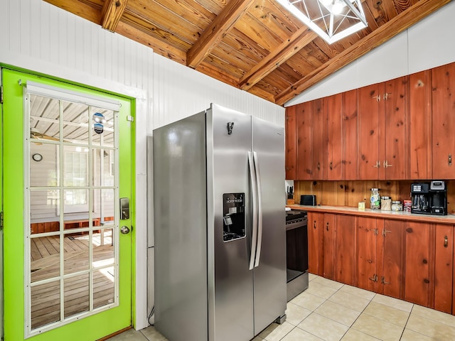 kitchen with light tile patterned floors, wood ceiling, stainless steel appliances, and vaulted ceiling with beams