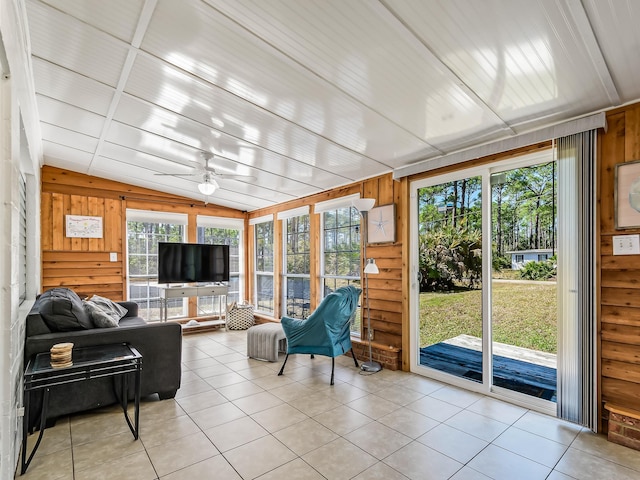 sunroom featuring vaulted ceiling and ceiling fan