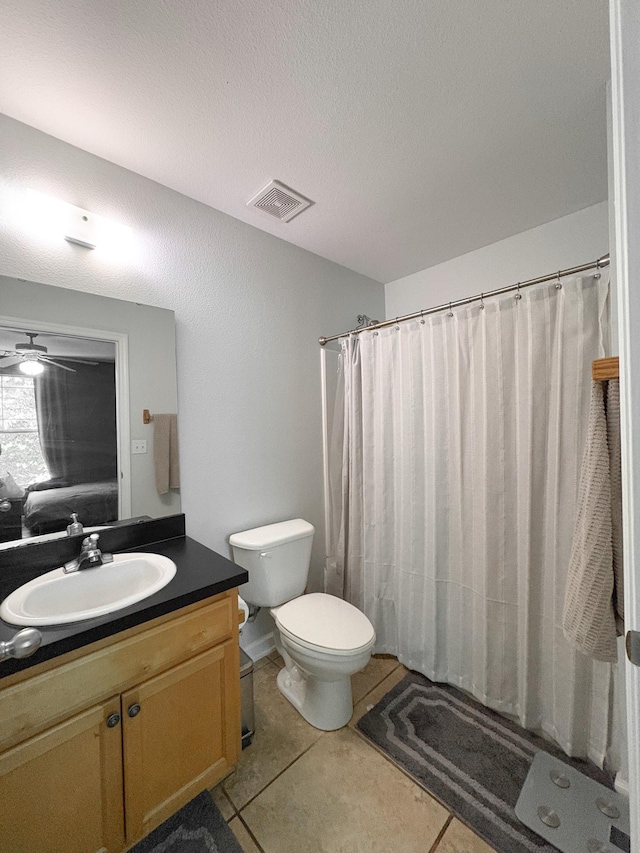 1417 Pullen Rd Unit 402, Tallahassee, FL 32303 - bathroom with vanity, toilet, tile patterned floors, and curtained shower