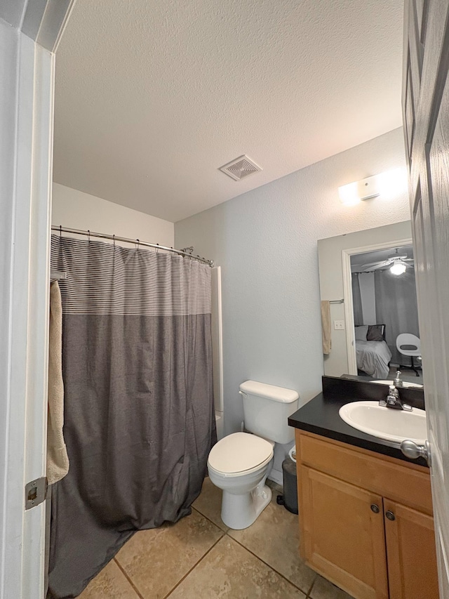 1417 Pullen Rd Unit 402, Tallahassee, FL 32303 - full bathroom featuring vanity, toilet, tile patterned flooring, a textured ceiling, and curtained shower
