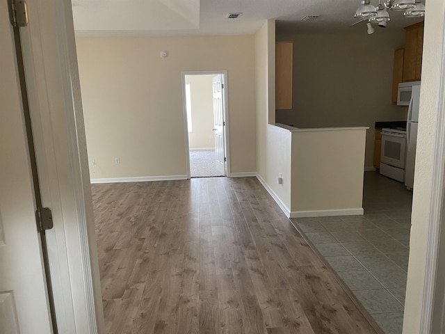 interior space featuring light hardwood / wood-style floors and white appliances