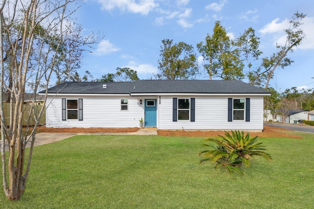 ranch-style home featuring a front yard