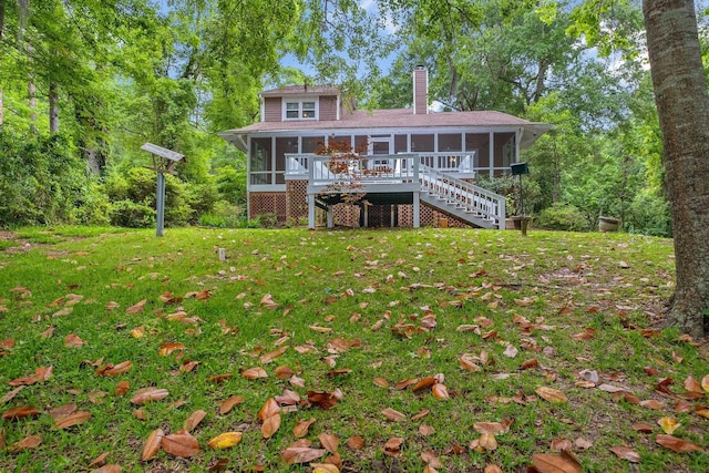 414 Tharpe Cir, Quincy, FL 32351 - rear view of property featuring a sunroom, stairway, a chimney, and a lawn