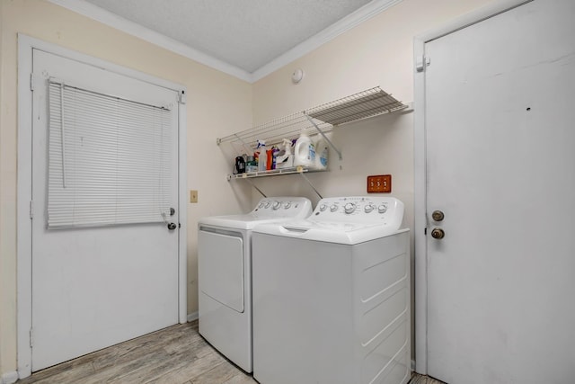 414 Tharpe Cir, Quincy, FL 32351 - clothes washing area featuring separate washer and dryer, crown molding, and light wood-type flooring