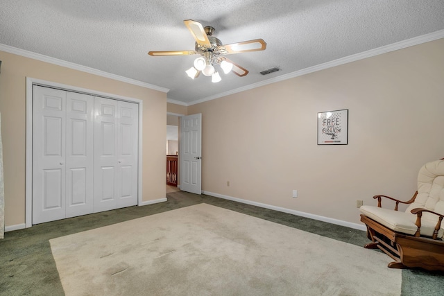 414 Tharpe Cir, Quincy, FL 32351 - bedroom with carpet flooring, crown molding, a closet, a textured ceiling, and a ceiling fan