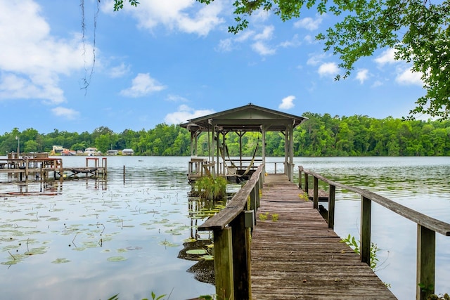 414 Tharpe Cir, Quincy, FL 32351 - dock area with a water view and a wooded view