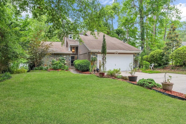 414 Tharpe Cir, Quincy, FL 32351 - view of side of home featuring stone siding, concrete driveway, a yard, an attached garage, and a shingled roof