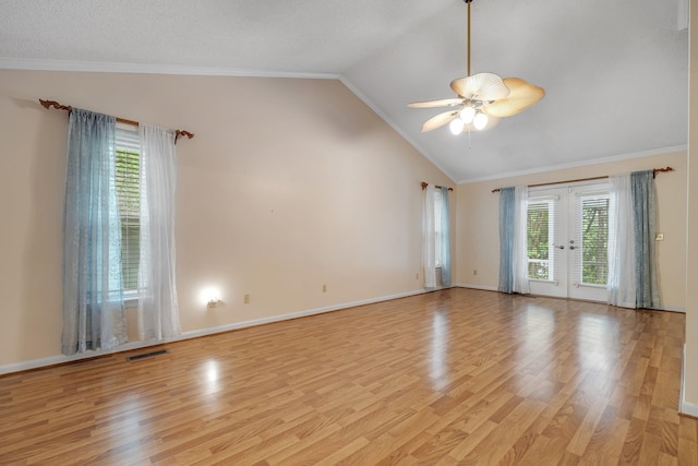 414 Tharpe Cir, Quincy, FL 32351 - empty room with vaulted ceiling, french doors, light wood finished floors, ornamental molding, and a ceiling fan