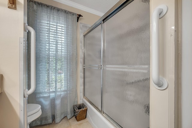 414 Tharpe Cir, Quincy, FL 32351 - bathroom featuring shower / bath combination with glass door, crown molding, tile patterned flooring, and toilet