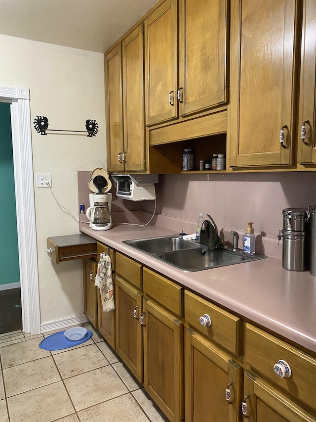 3320 Big Lake Rd, Tallahassee, FL 32303 - kitchen with light tile patterned floors, brown cabinetry, open shelves, and light countertops