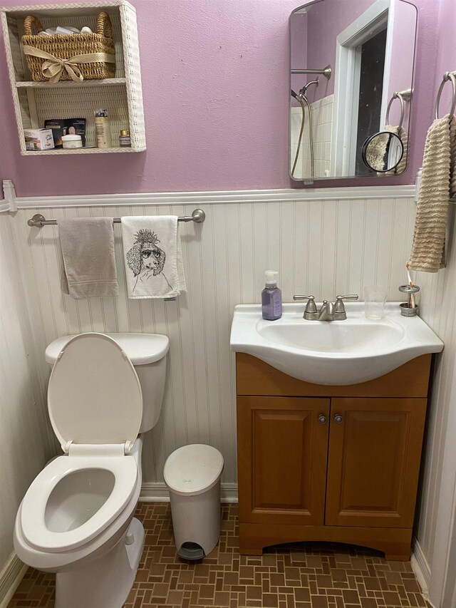 3320 Big Lake Rd, Tallahassee, FL 32303 - bathroom featuring vanity, wainscoting, and brick patterned floors