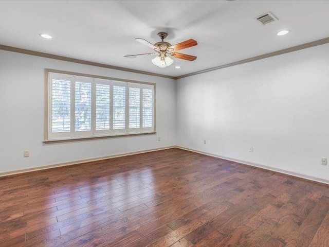 empty room featuring ornamental molding, dark hardwood / wood-style floors, and ceiling fan