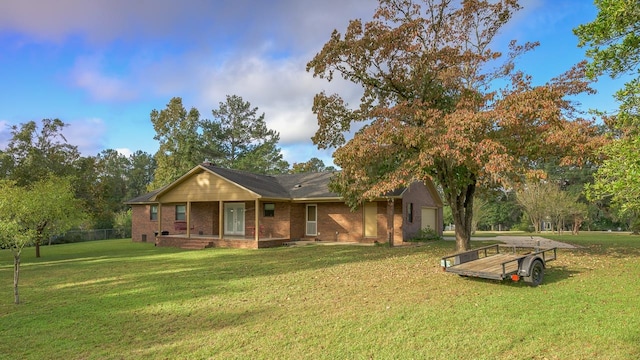 ranch-style home with a front yard