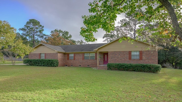 ranch-style house featuring a front lawn