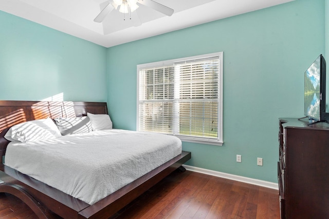 bedroom with dark wood-type flooring and ceiling fan