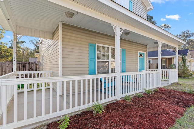 view of side of property with a porch