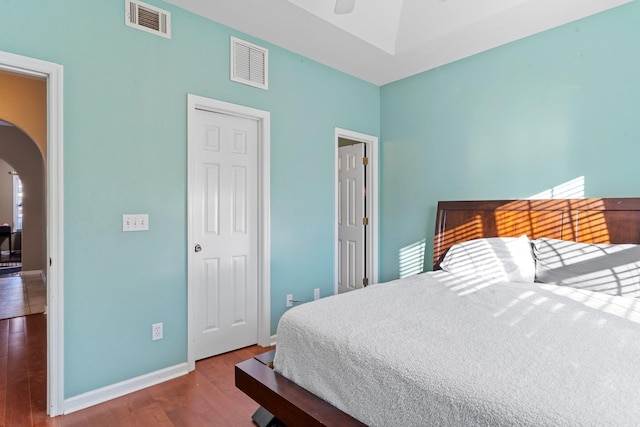 bedroom with hardwood / wood-style flooring and ceiling fan