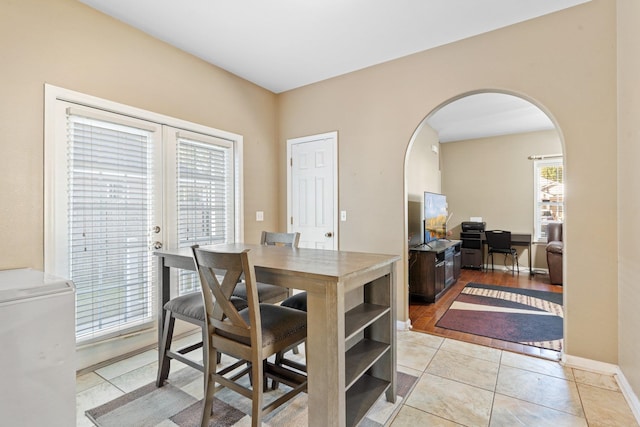 dining area with light tile patterned floors