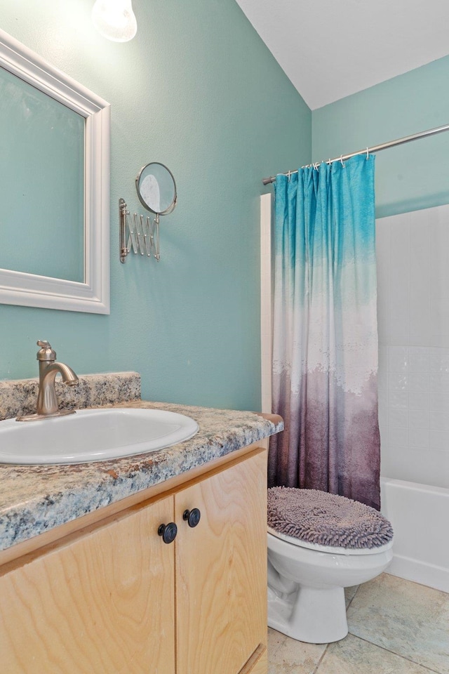 full bathroom featuring shower / bath combo, vanity, tile patterned floors, and toilet