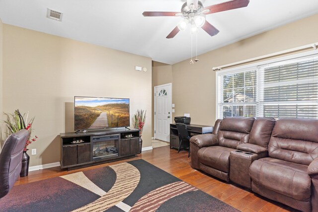 living room featuring light wood-type flooring and ceiling fan