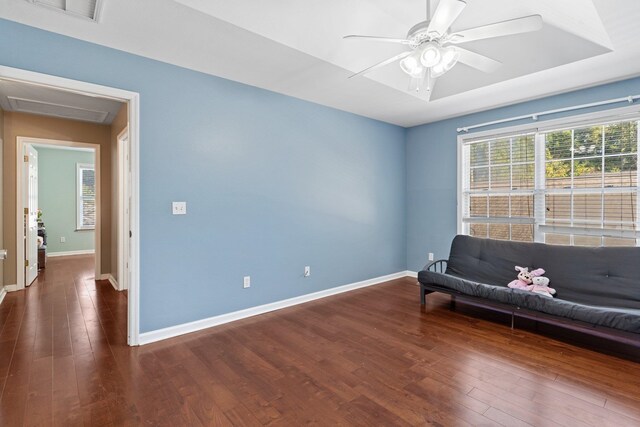 unfurnished room featuring ceiling fan and dark hardwood / wood-style floors