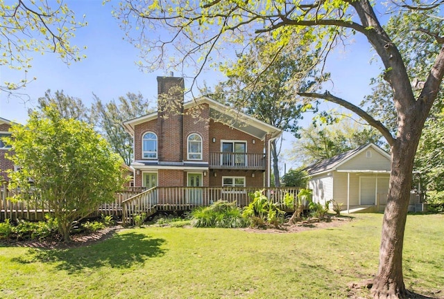 view of front of house with a front lawn, a balcony, a garage, and brick siding