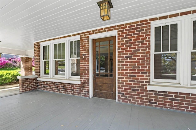 wooden terrace with a porch