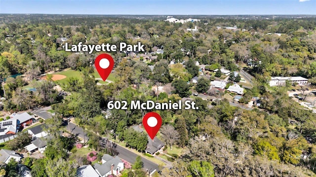 birds eye view of property with a residential view and a forest view