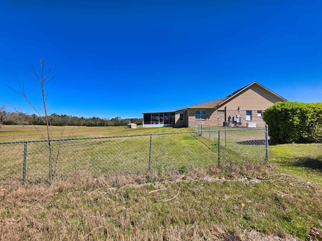 view of yard with a fenced backyard and a rural view