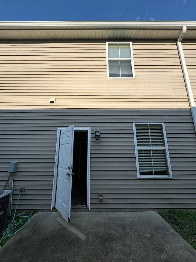 back of property featuring central AC unit