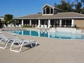 view of pool featuring a patio