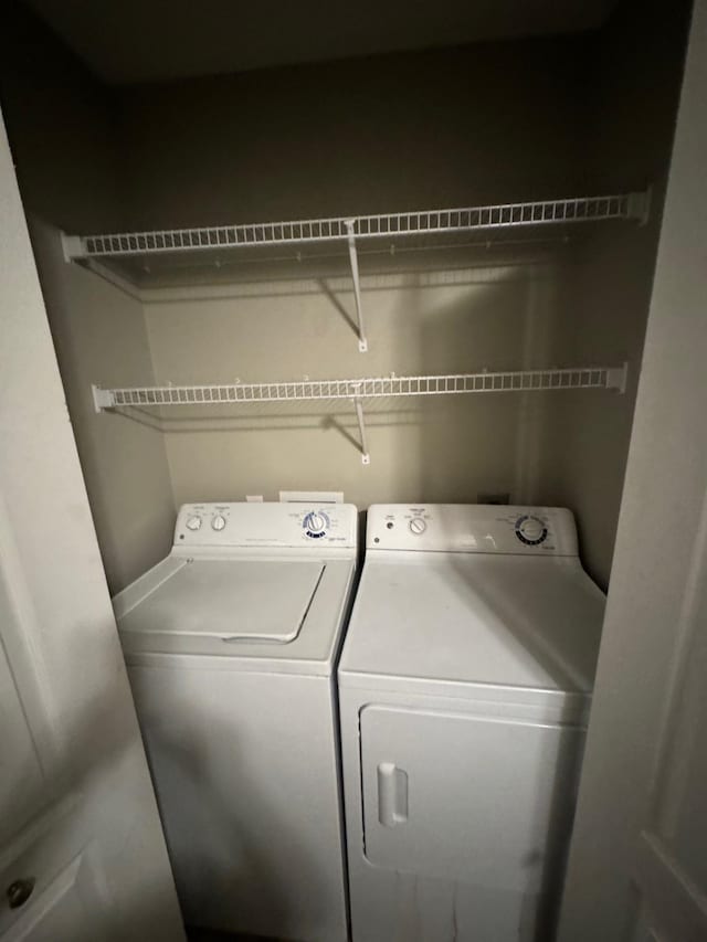 laundry area with independent washer and dryer