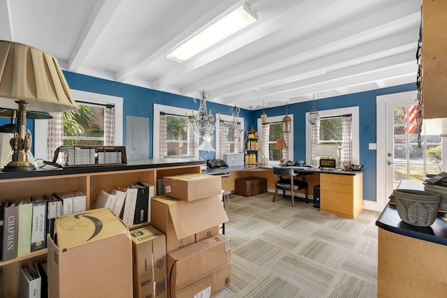 carpeted office space with beamed ceiling