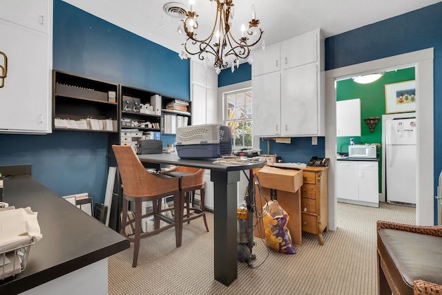 office featuring light carpet and a notable chandelier
