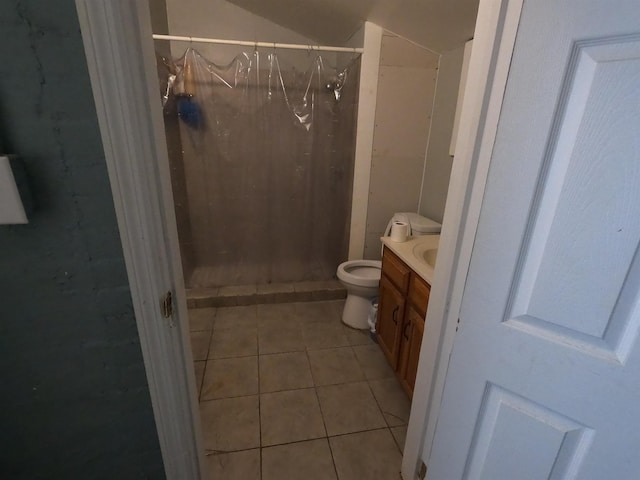 bathroom with tile patterned flooring, vanity, curtained shower, and toilet