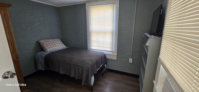 bedroom with dark wood-type flooring