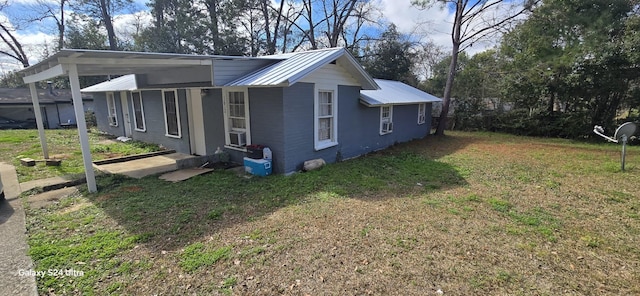 view of side of home featuring a yard