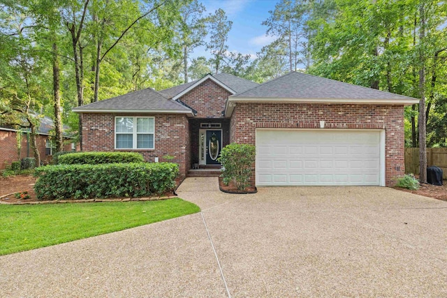 1652 Eagles Watch Way, Tallahassee, FL 32312 - view of front of home featuring concrete driveway, brick siding, roof with shingles, and an attached garage