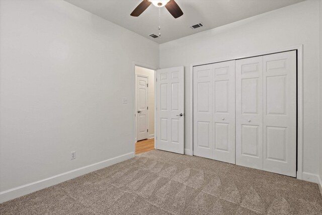 1652 Eagles Watch Way, Tallahassee, FL 32312 - unfurnished bedroom featuring carpet, a closet, and a ceiling fan
