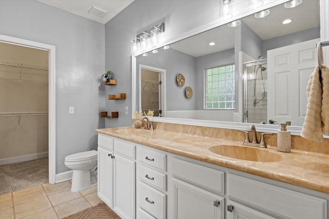 1652 Eagles Watch Way, Tallahassee, FL 32312 - full bathroom with double vanity, a shower stall, a spacious closet, and tile patterned flooring