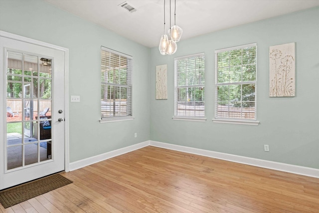 1652 Eagles Watch Way, Tallahassee, FL 32312 - unfurnished dining area featuring light wood-style floors and baseboards