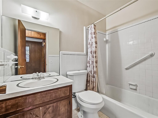 full bathroom featuring vanity, shower / bathtub combination with curtain, tile walls, tile patterned flooring, and toilet