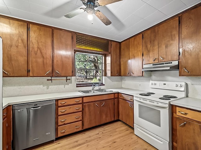 kitchen with white electric range, sink, light hardwood / wood-style flooring, stainless steel dishwasher, and tasteful backsplash