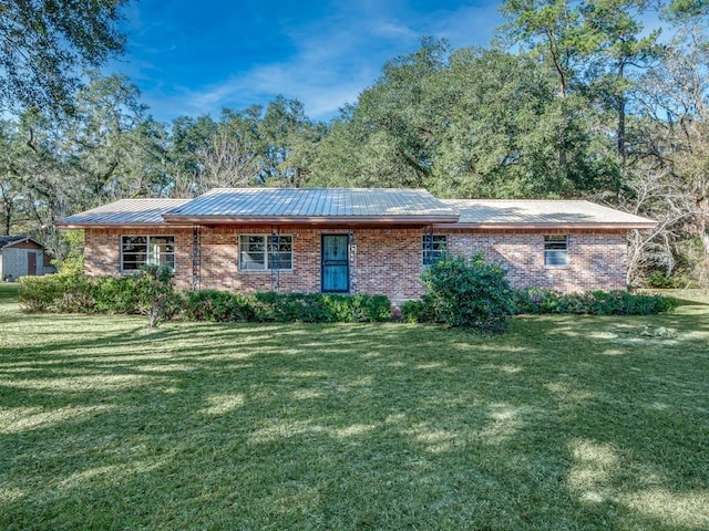 ranch-style home featuring a front yard