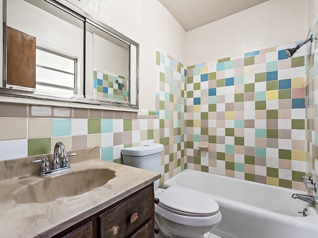 bathroom with decorative backsplash, toilet, and vanity