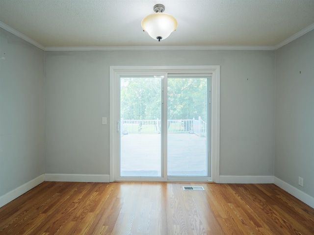 405 NW Whispering Pines Loop, Madison, FL 32340 - spare room with wood finished floors and ornamental molding