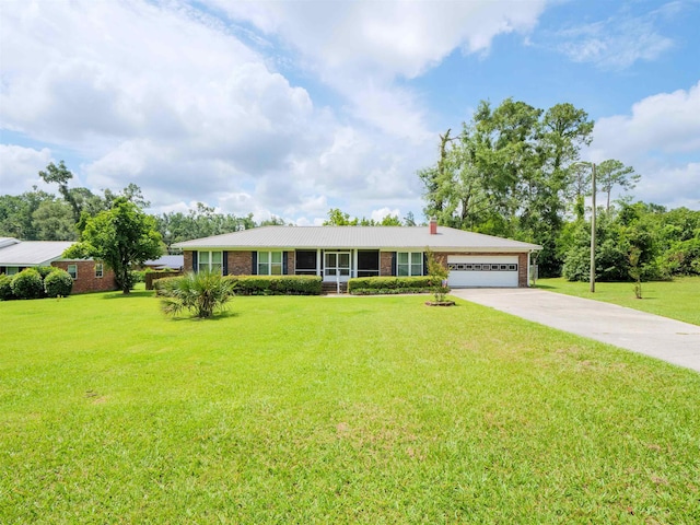 405 NW Whispering Pines Loop, Madison, FL 32340 - ranch-style house featuring brick siding, an attached garage, concrete driveway, and a chimney