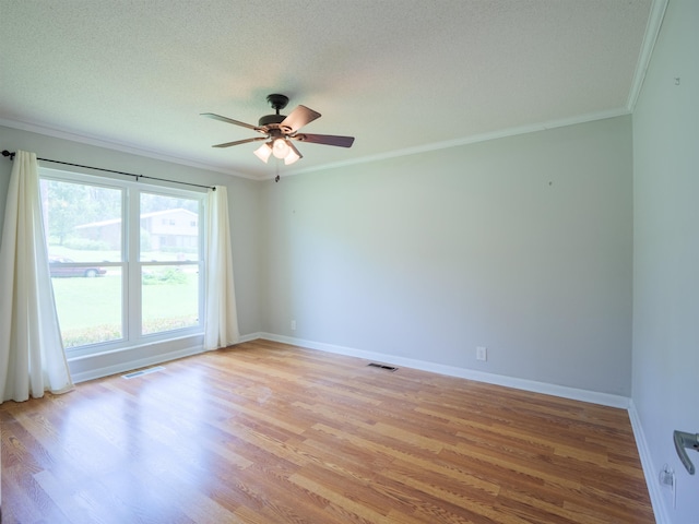 405 NW Whispering Pines Loop, Madison, FL 32340 - empty room featuring ornamental molding, ceiling fan, light wood finished floors, and a textured ceiling